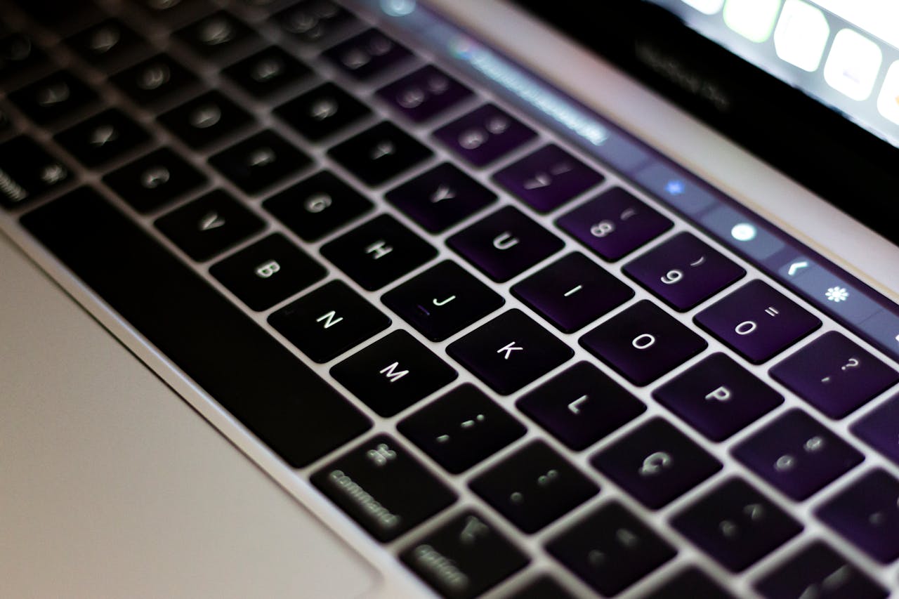 why-choose-us Detailed close-up of a modern laptop keyboard, highlighting the keys and sleek design.